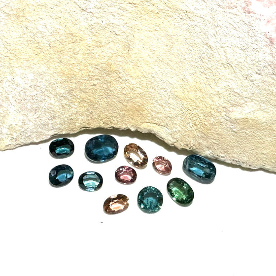 This parcel of 11 mixed cuts of natural unheated tourmaline ranges from light green to&nbsp; teal blue and peach pink They are all eye clean. The depth varies.