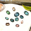 This parcel of 11 mixed cuts of natural unheated tourmaline ranges from light green to&nbsp; teal blue and peach pink They are all eye clean. The depth varies.